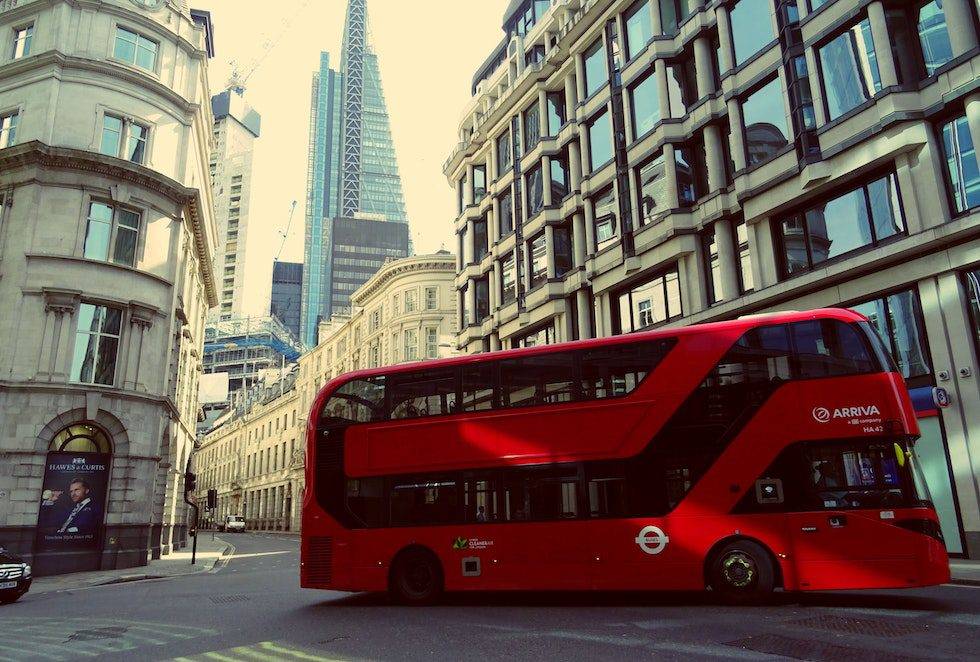 Red Bus beside building